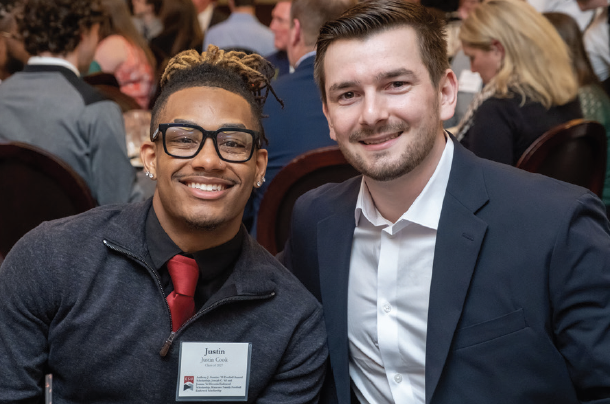 Justin T. Cook, a freshman exercise science major, sits with Anthony J. Guarino ’19 at the 15th Annual Scholarship Dinner.