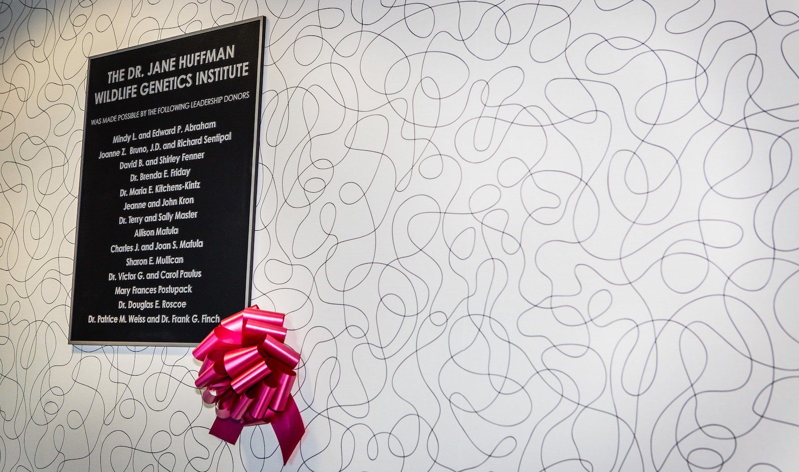 The leadership donor plaque mounted outside the Dr. Jane Huffman Wildlife Genetics Institute.